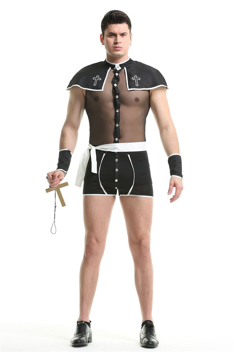 Man in a sheer black costume with buttons, white trim, and crosses. He wears matching shorts, holds a wooden cross, and stands confidently on a plain background.