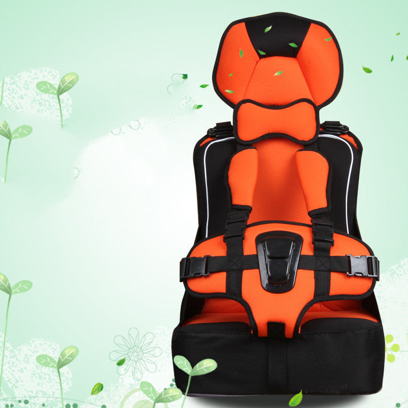 Bright orange and black car seat with adjustable straps and headrest, set against a light green background with leaf and flower illustrations.