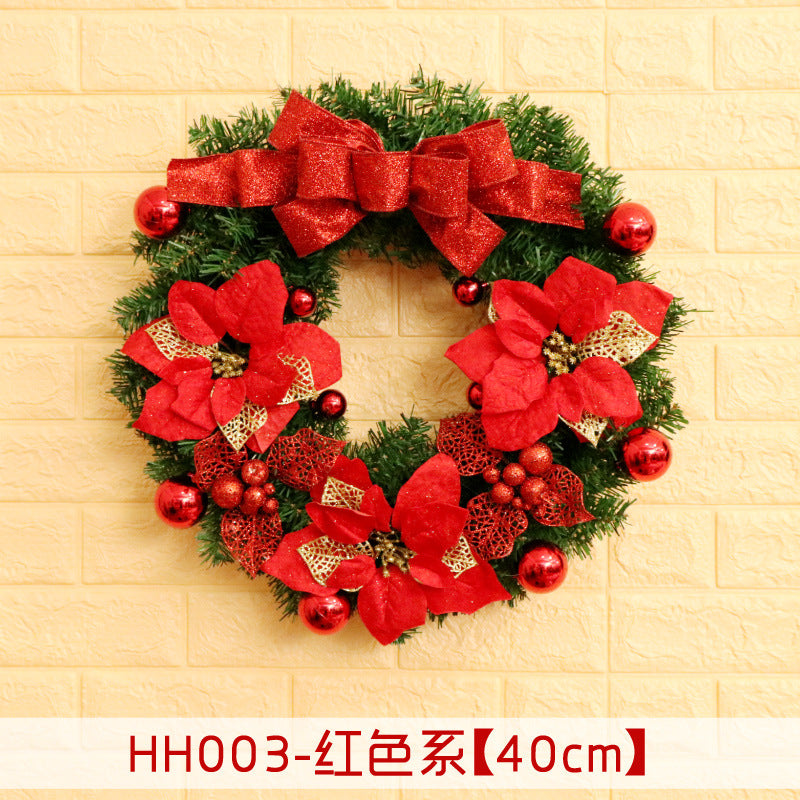 Festive holiday wreath adorned with red bows, flowers, and ornaments, set against a brick background. A label below reads "HH003-红色系【40cm】".