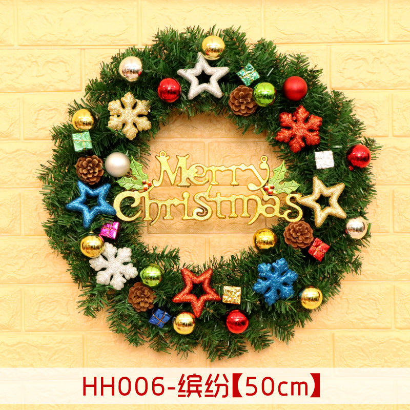 Festive Christmas wreath adorned with colorful baubles, stars, snowflakes, pinecones, and gift boxes, featuring a "Merry Christmas" sign in the center.