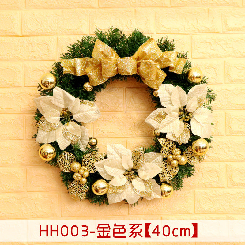 Festive wreath with gold ribbon, white flowers, and gold ornaments on a green base, against a light yellow brick wall. Text at bottom in Chinese and dimensions: 40cm.