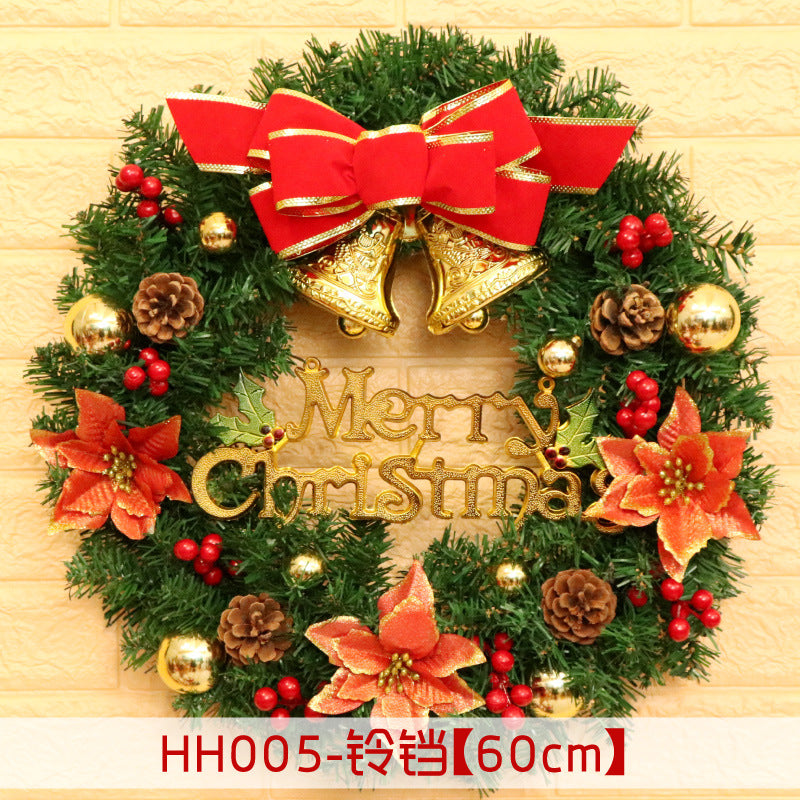 Festive Christmas wreath with red poinsettias, pinecones, berries, and gold ornaments. Features a "Merry Christmas" sign, topped with golden bells and a large red bow.