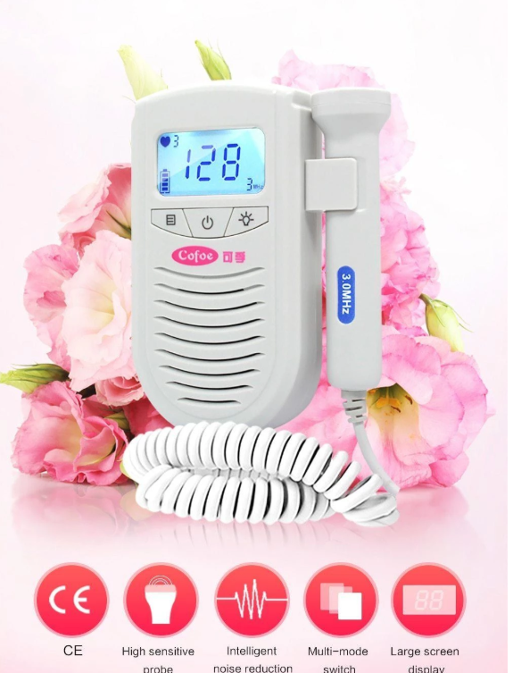 A handheld fetal doppler with a digital display reading "128" and a 3.0 MHz probe, set against pink flowers. Features icons for CE, high sensitivity, and noise reduction.