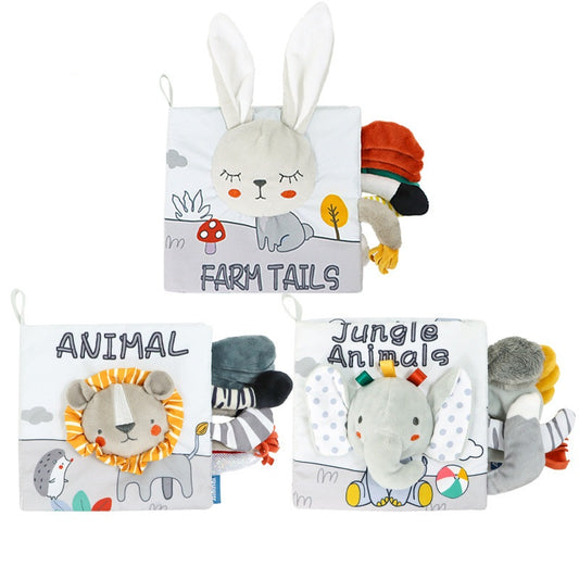Three soft fabric books for children featuring animal designs: a rabbit on "Farm Tails", a lion on "Animal", and an elephant on "Jungle Animals", with colorful tails.