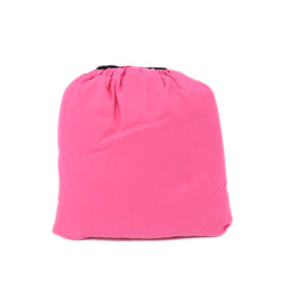 A pink drawstring bag with a black opening on top, standing upright against a plain white background.