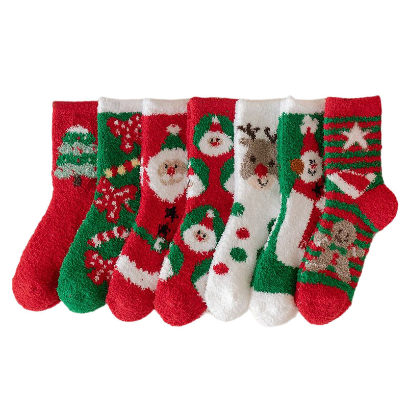 Seven festive Christmas socks in red, green, and white feature designs of Santa, reindeer, snowflakes, a snowman, and Christmas trees, arranged side by side.