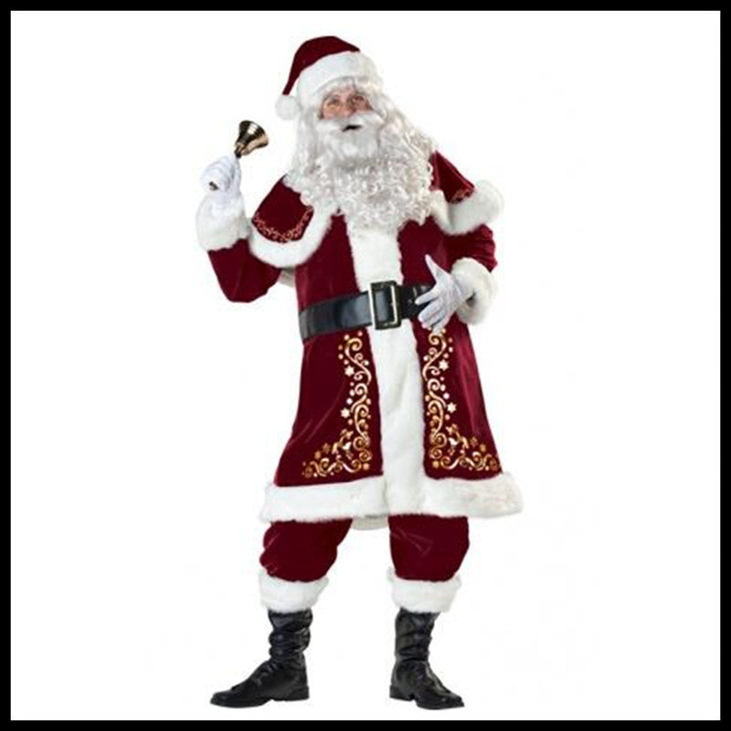 Santa Claus in a red and white suit holding a bell, with intricate gold designs on his coat, black boots, and a wide belt, stands against a white background.