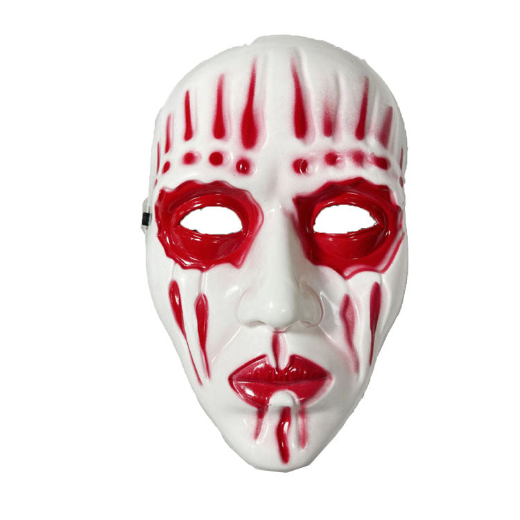 White mask with red tribal markings around the eyes, forehead, and mouth. The design features elongated red streaks and dots, creating a dramatic and intense appearance.