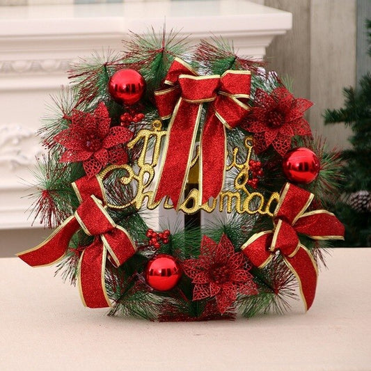 A festive Christmas wreath with red bows, poinsettias, and ornaments, accented by green pine needles. The words "Merry Christmas" are displayed in gold at the center.