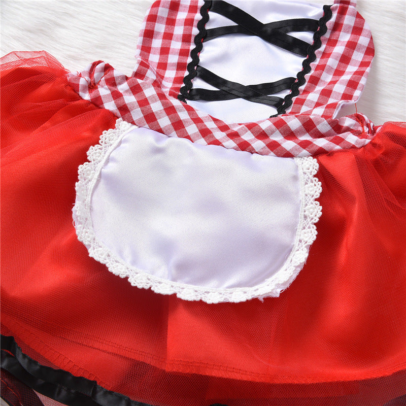 Red and white checkered dress with black lace-up front and white lace-trimmed apron. The skirt is bright red with a layered tulle overlay, resting on a white background.