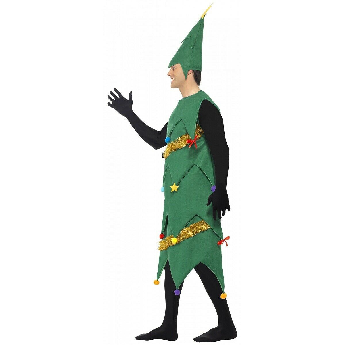 Person in a Christmas tree costume with green felt layers, colorful pom-poms, and gold tinsel, wearing black gloves, waving.