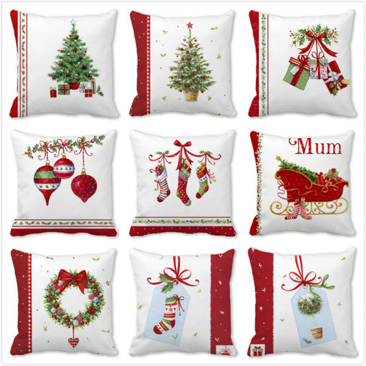 Nine Christmas-themed pillows with designs of trees, ornaments, stockings, gifts, and a sleigh. Each pillow has festive red, green, and white holiday motifs.