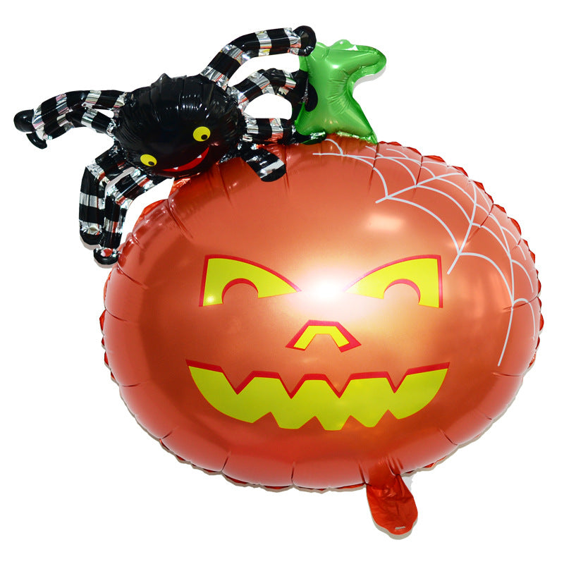 Orange jack-o'-lantern balloon with green stem and web design, topped by a black spider with striped legs and yellow eyes.