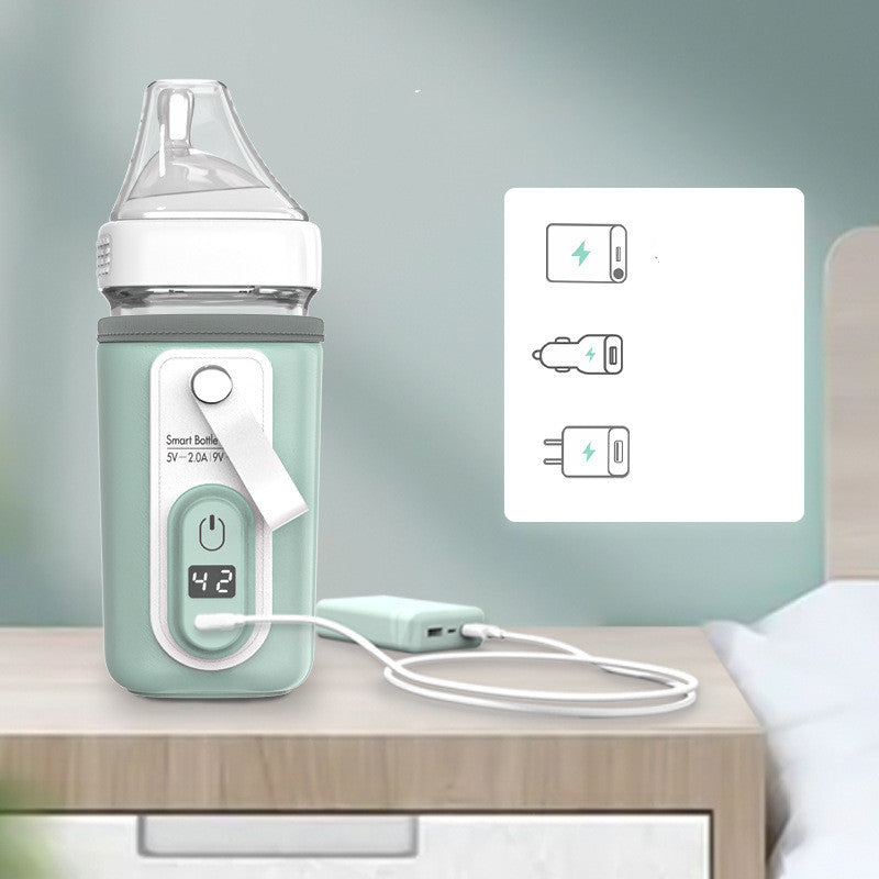 Smart baby bottle with digital display showing 42°C, placed on a nightstand. It is connected to a charger, with icons indicating power bank, car, and wall charging options.