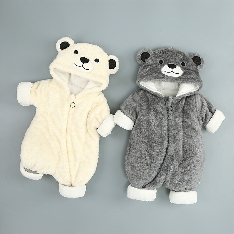 Two cozy baby onesies shaped like bears. One is cream with a cute bear face on the hood and black ears; the other is gray with a similar design. Both have white cuffs.