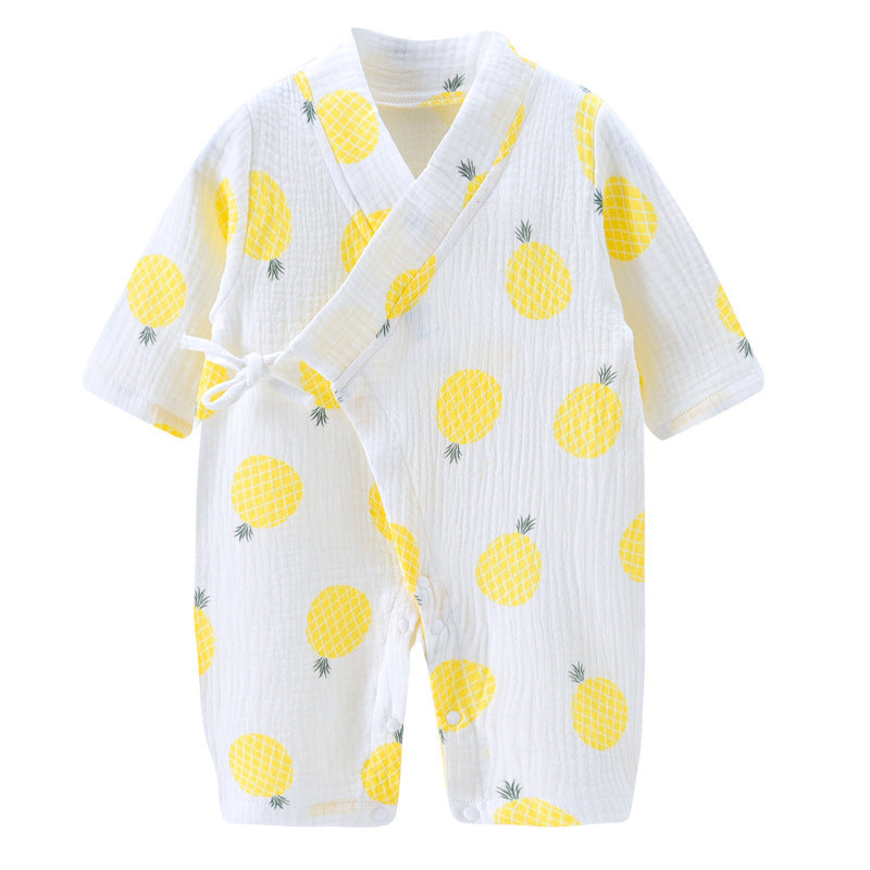 White baby romper with yellow pineapple print, featuring long sleeves and a wrap-over front with tie closure. Made of soft, lightweight fabric.