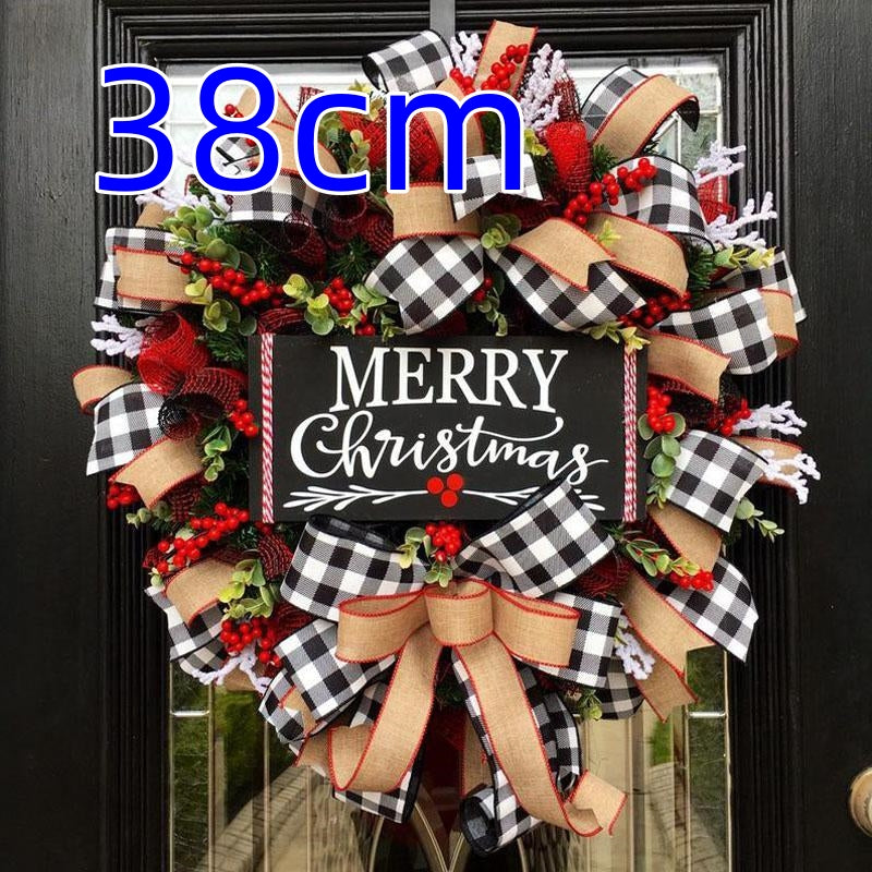 Festive Christmas wreath with "Merry Christmas" sign, adorned with checkered and red ribbons, berries, and greenery, measuring 38cm, hanging on a door.