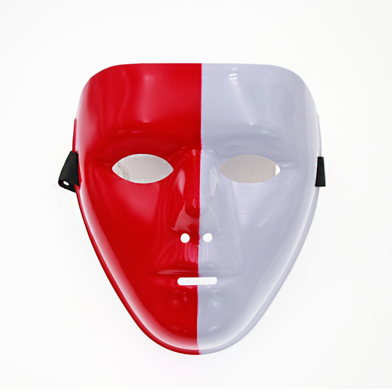 A two-tone mask split vertically, half red and half white, with cutouts for eyes and mouth, against a white background.