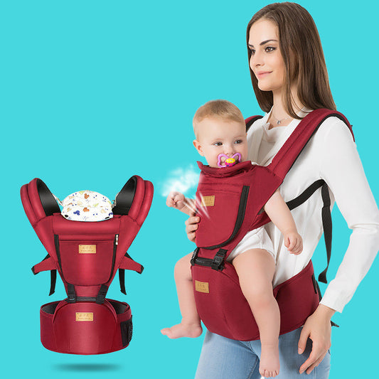 A woman wearing a white shirt carries a baby in a red baby carrier against a turquoise background. The baby, with a pacifier, is securely held. A separate image of the carrier is displayed.