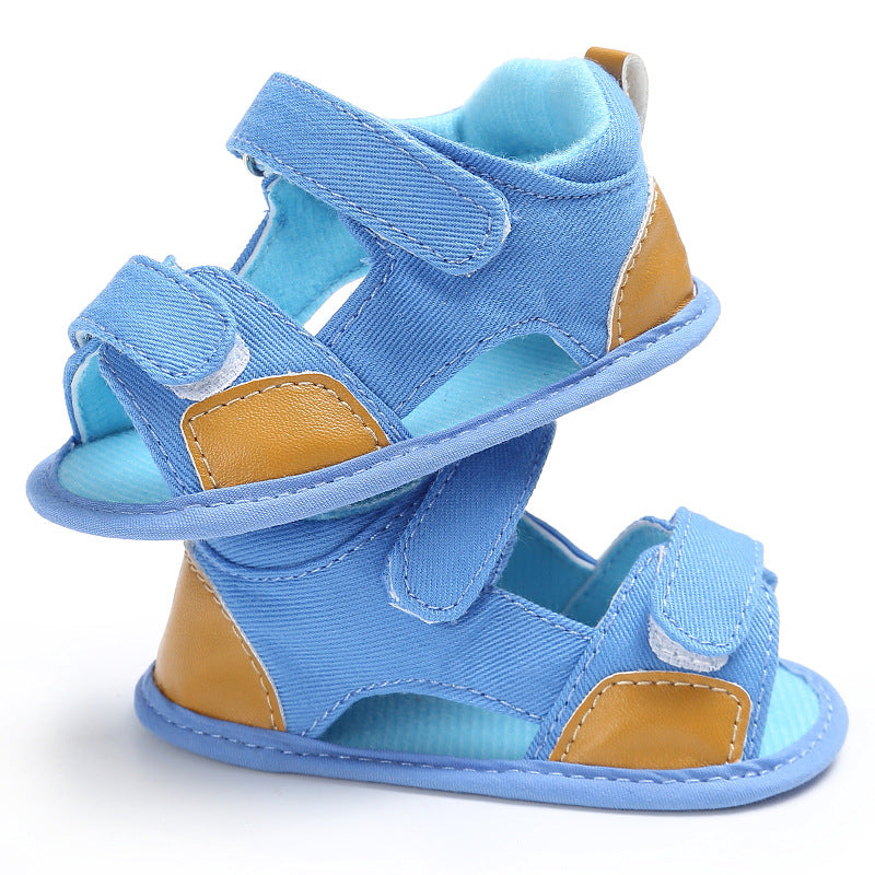 Light blue and tan toddler sandals stacked together, featuring velcro straps and soft inner lining, designed for comfort and ease of wear.