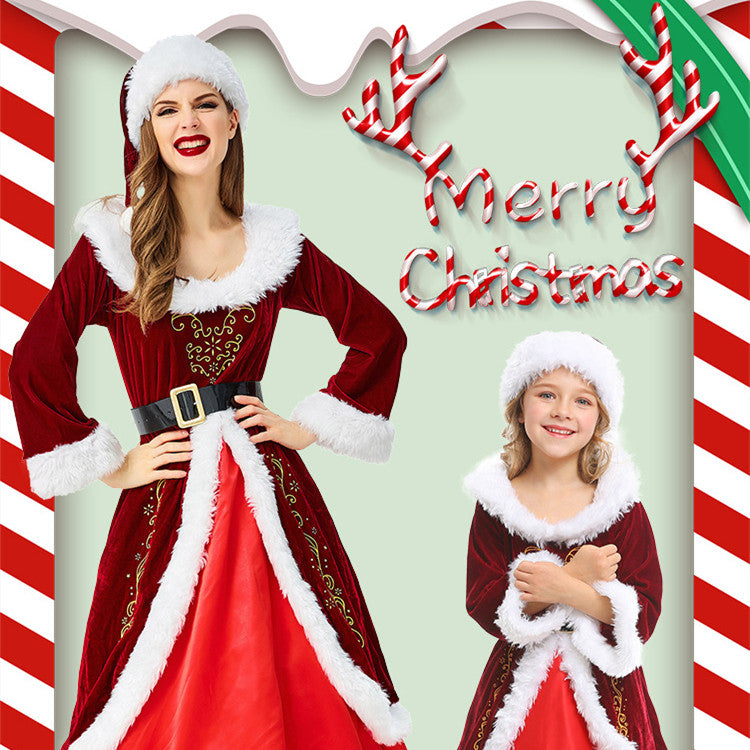 Two people wearing matching red and white Santa dresses with fluffy trim and Santa hats. "Merry Christmas" is written above them with candy cane stripes.