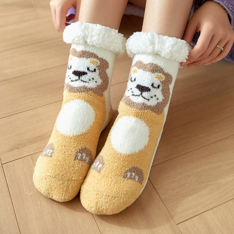 Cozy socks featuring a cute lion design with a fluffy cuff. They are worn on a wooden floor, showcasing a playful lion face and paw patterns in warm hues.