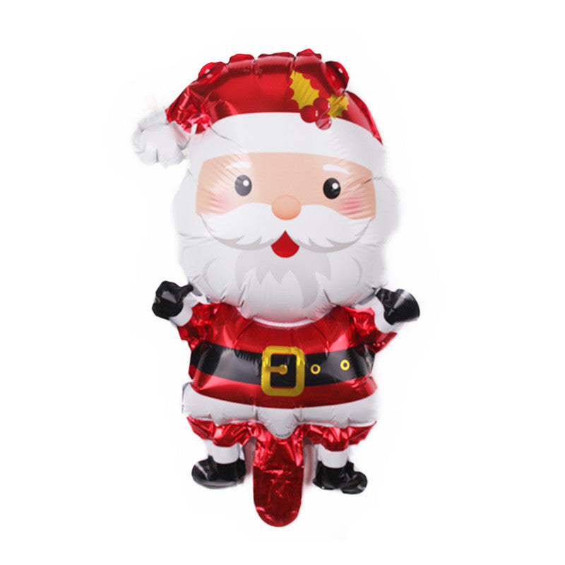 A shiny, festive foil balloon shaped like Santa Claus, featuring a jolly face, white beard, and red suit with a black belt and gold buckle, adorned with a holly sprig.