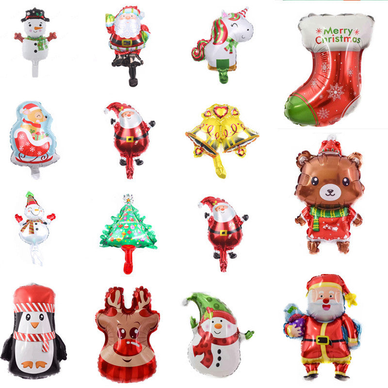 A collection of festive Christmas balloons featuring icons like Santa, a snowman, a reindeer, a Christmas tree, a penguin, a bear, a unicorn, and a stocking, in bright colors.