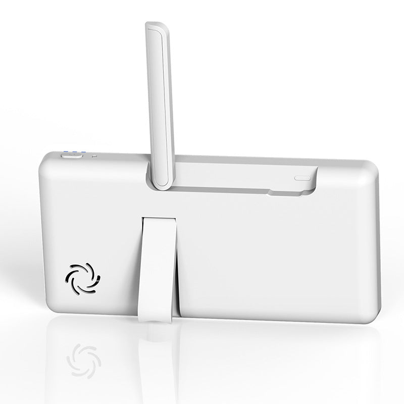 White digital device with a stand and an antenna on the back. Features a small ventilation grille on the lower left corner, resting on a reflective surface.