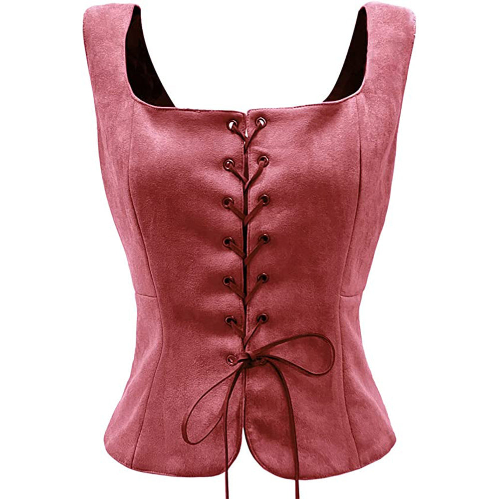 Pink suede corset top with a square neckline and lace-up detailing at the front. The fabric has a soft texture, and the laces are tied in a neat bow at the bottom.