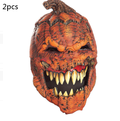 Detailed Halloween mask of a menacing pumpkin with large, sharp yellow teeth and an evil grin. The orange texture resembles a carved pumpkin. Labeled "2pcs" in the corner.