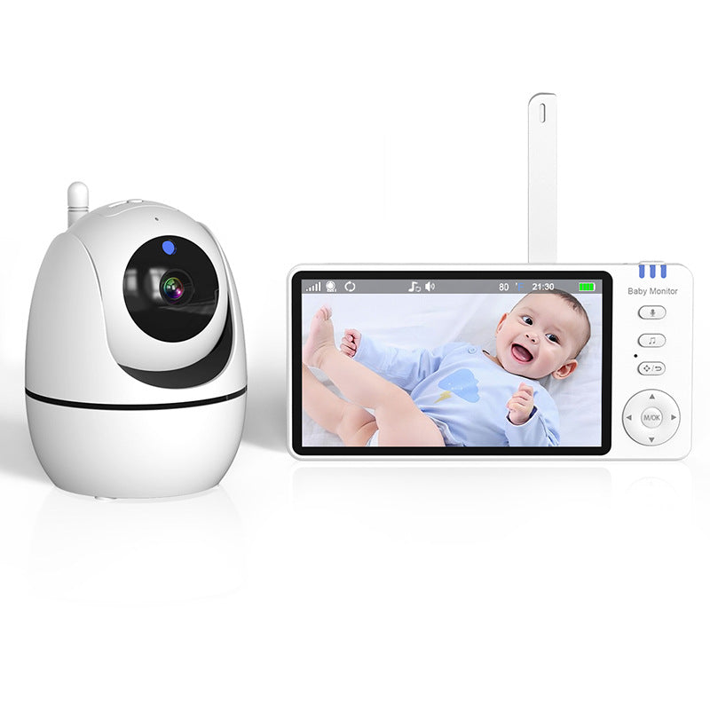 A white baby monitor camera with an LCD screen displaying a smiling baby wearing a blue outfit. The camera and screen are placed side by side on a white background.