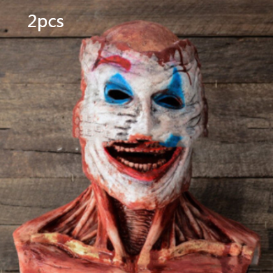 A Halloween mask with a distorted, creepy face and exaggerated makeup, featuring exposed muscles and teeth, against a wooden background. Text in the image reads "2pcs."