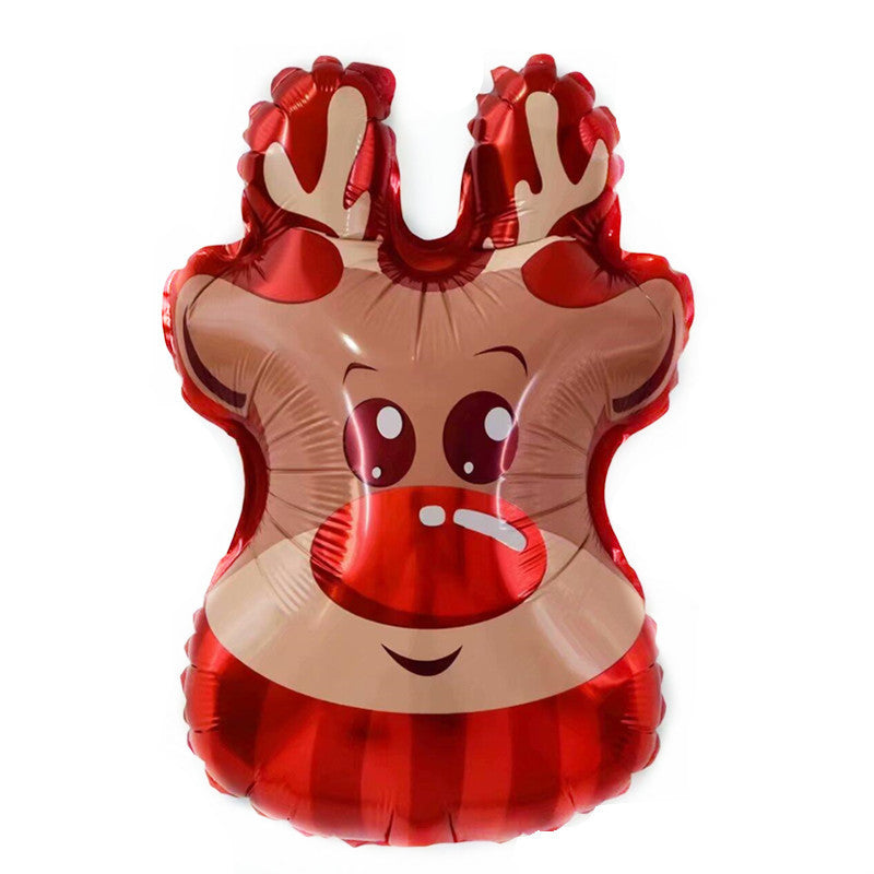 Foil balloon shaped like a cartoon reindeer head, with big eyes, red nose, and antlers. The balloon is shiny with red and beige colors, giving a festive appearance.
