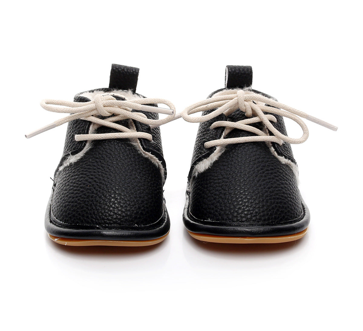 Black toddler shoes with textured leather and white laces. The shoes have light brown soles and a pull tab on the heel, displayed in a front view on a white background.