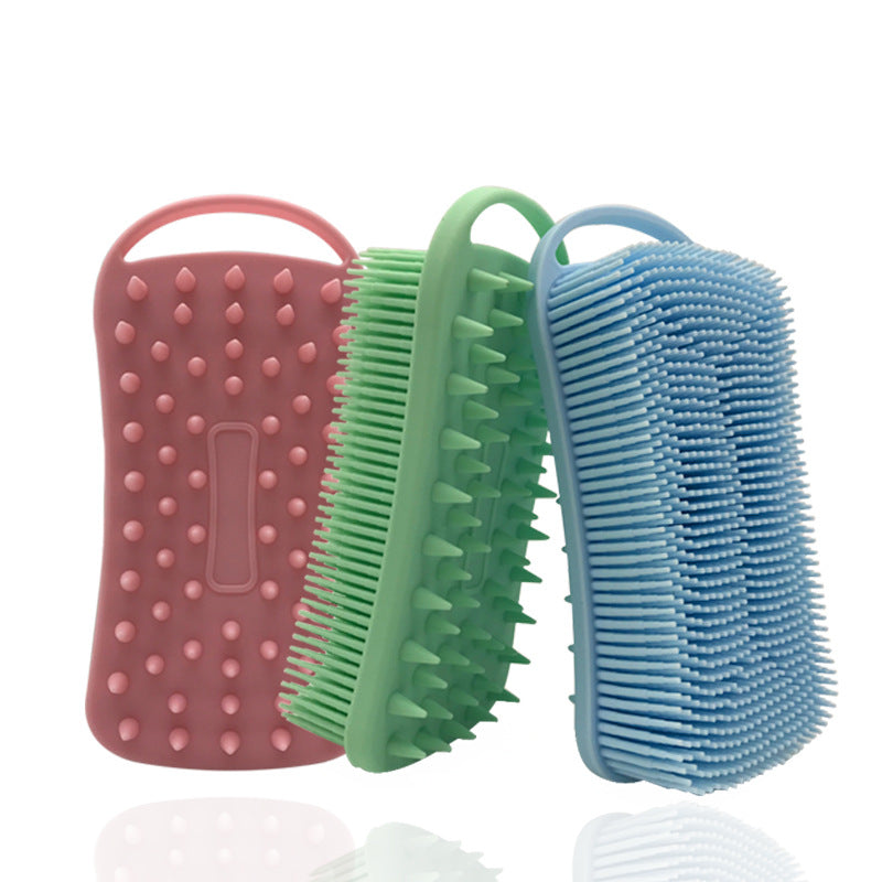 Three silicone bath scrubbers in pink, green, and blue with varied textures for exfoliating purposes, each with a convenient handle for grip.