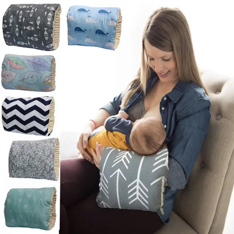 A woman uses a breastfeeding pillow with arrow patterns to nurse her baby. Six pillow designs are displayed on the left, including fish, whales, leaves, chevron, floral, and geometric patterns.