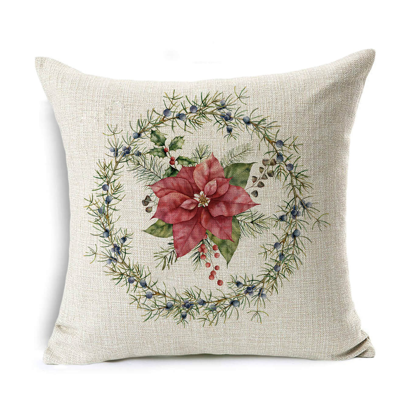 A beige throw pillow features a detailed Christmas wreath design with pine branches, blueberries, and a large central red poinsettia flower surrounded by green leaves.