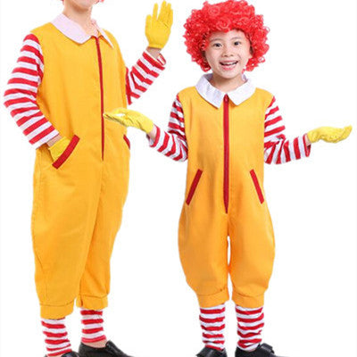 Two people wearing matching yellow jumpsuits with red and white striped shirts and gloves. One person has curly red hair, both smiling, striking playful poses.
