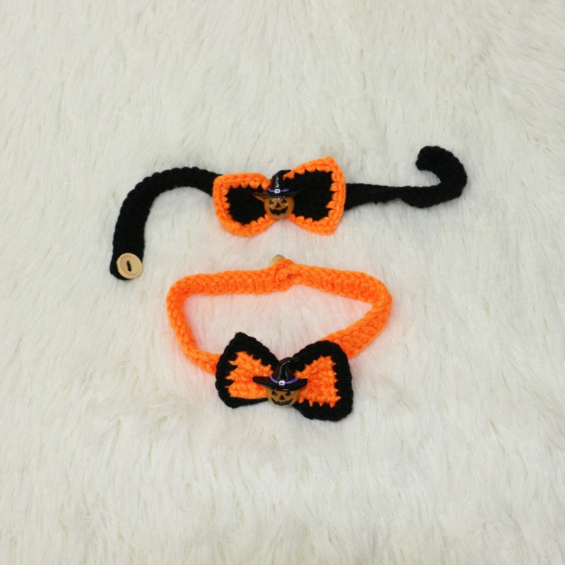 Two crochet bow ties, one black with orange trim and one orange with black trim, featuring small pumpkin decorations, displayed on a soft white surface.