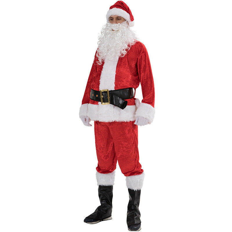 Person dressed as Santa Claus in a red and white costume with a fluffy beard, black belt, and shiny boots, standing against a white background.