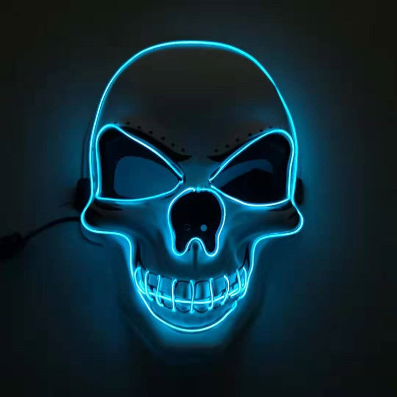 Glowing blue neon skull mask with prominent eye sockets and teeth, set against a dark background. The mask features a stylized, menacing expression.