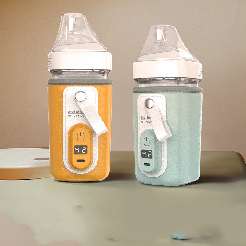 Two smart baby bottles in yellow and green with digital thermometers displaying 42°C. Both bottles have clear lids and white accents, set against a neutral background.