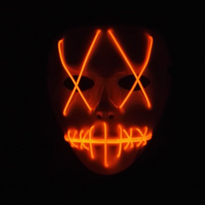 A dark background highlights a mask with glowing red-orange LED lights. The mask features crossed lines over the eyes and a grid pattern over the mouth, resembling a sinister face.