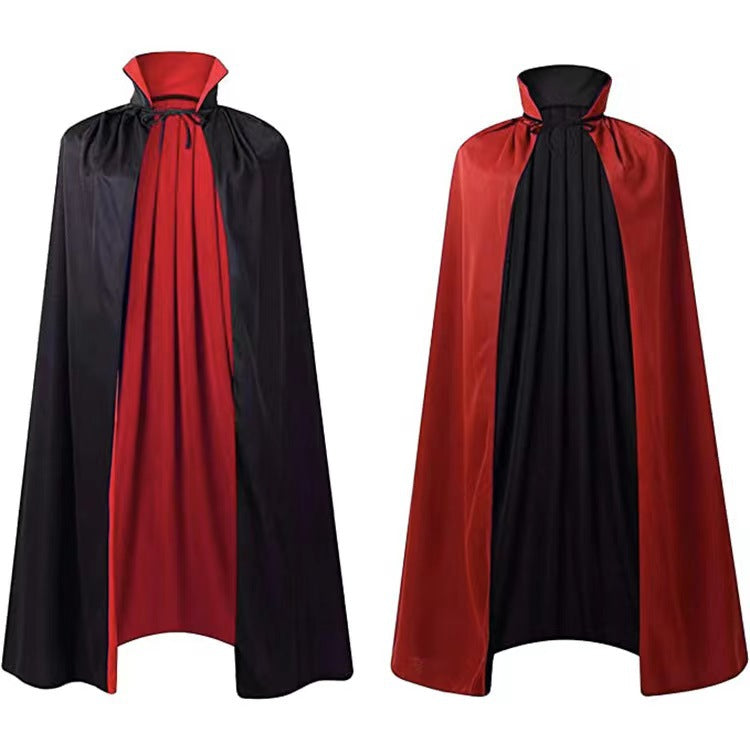 Two reversible vampire capes; one is black with a red lining, and the other is red with a black lining, both featuring high collars and tie closures.