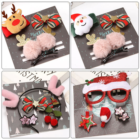Festive hair accessories: a reindeer and Santa plush clip, striped bows, fluffy pink pom clips, pink antler headband, cherries, star clips, and red Santa hat glasses.