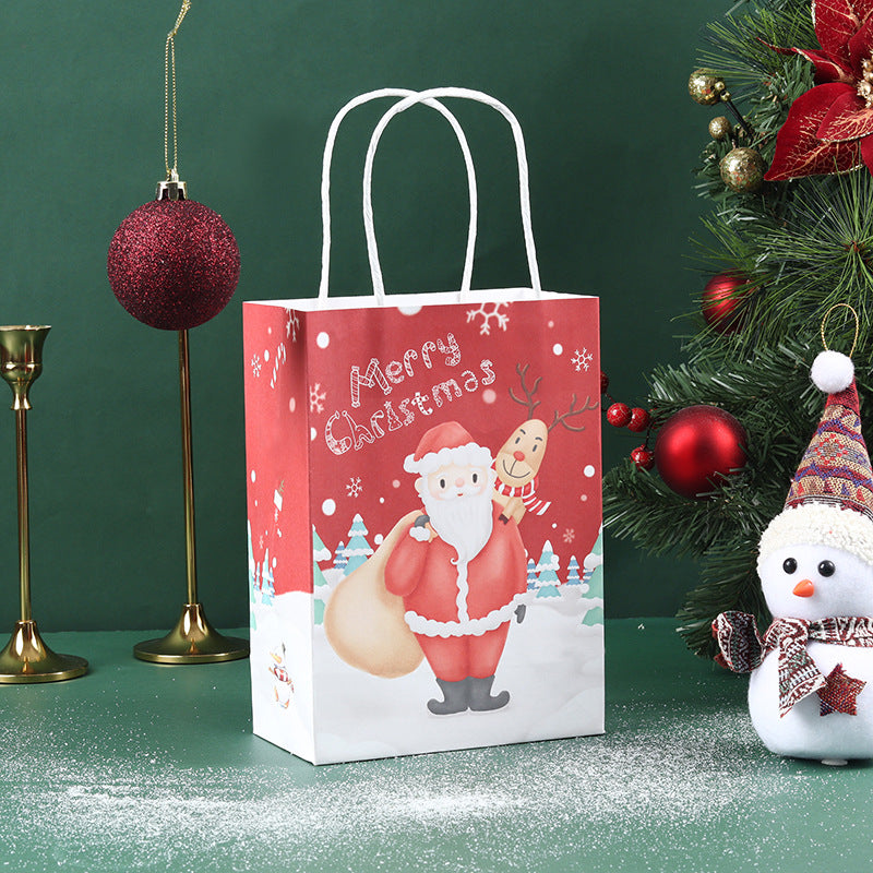 Festive scene with a red "Merry Christmas" gift bag featuring Santa and a reindeer, set amongst holiday decorations including a snowman, red ornaments, and greenery.