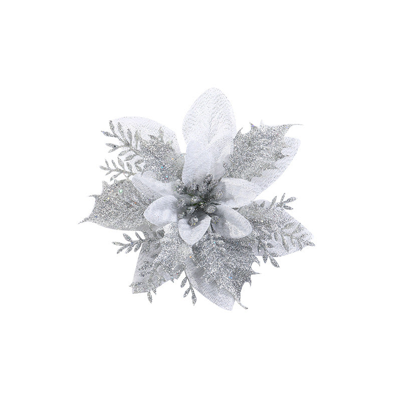 Silver glittery poinsettia decoration with layered petals and fern-like leaves, featuring shimmering accents on a white background.