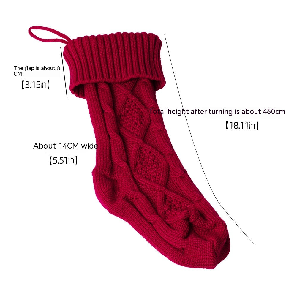 Red knitted Christmas stocking with a cable knit pattern. Measurements are labeled: 14cm wide, 8cm flap, and 46cm total height. Includes a hanging loop at the top.