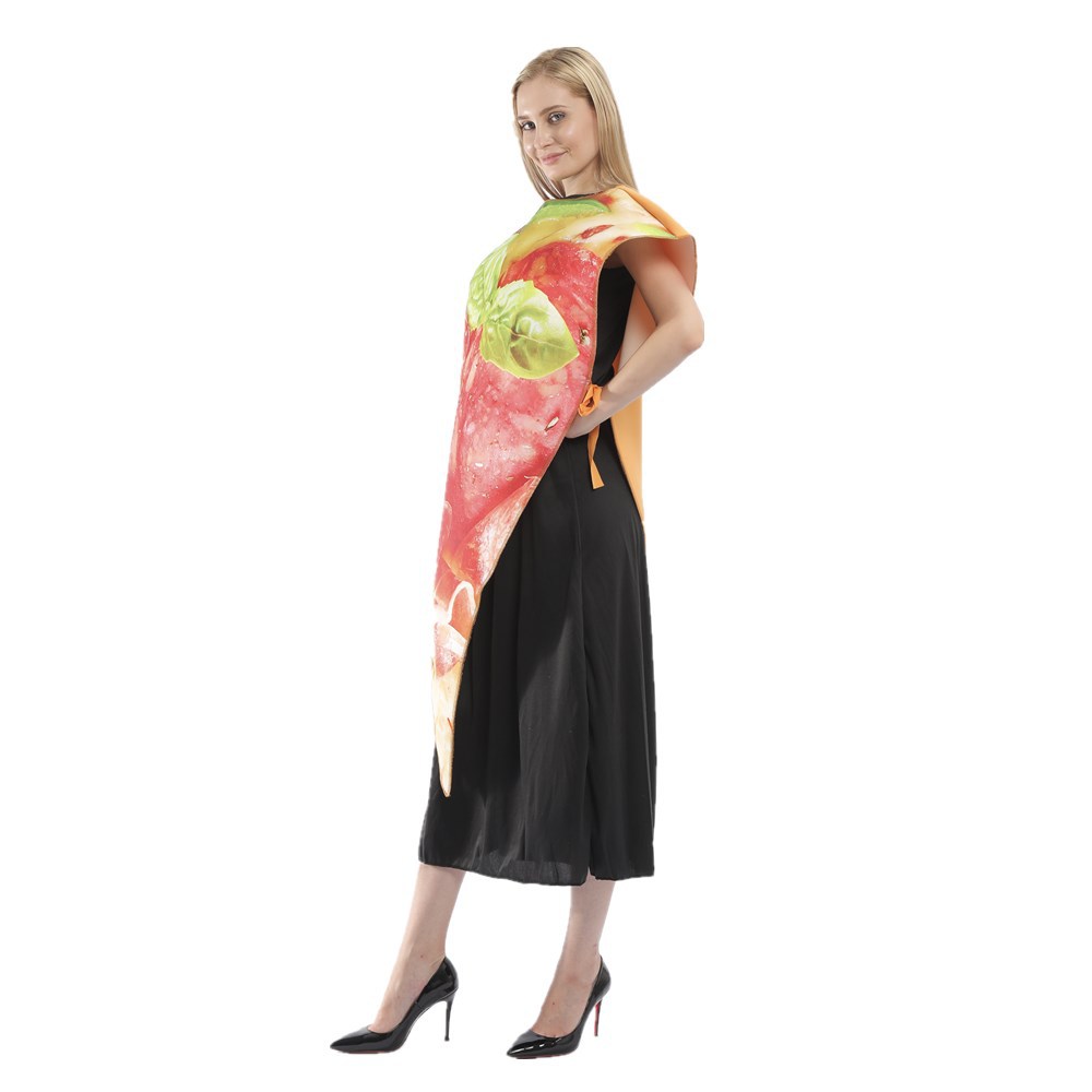 A woman poses in a black dress and high heels, wearing a novelty costume resembling a large pizza slice with toppings like tomatoes and basil. The costume wraps over her shoulder and extends asymmetrically to her knees. She stands against a plain white background.